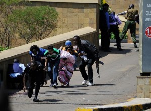 Survivors flee from the scene. AFP Photo