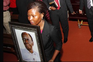 Mourners carry the casket of the late Sam Odaka former Foreign Affairs Minister in Milton Obote government at All Saints Nakasero August 6, 2015. The late died of cardiac arrest and intestine blockage. He is to be buried in Busia on Saturday (PHOTO: STEPHEN WANDERA)