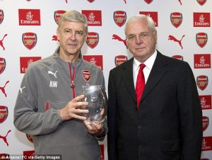 Arsenal chairman Sir Chips Keswick poses with Wenger