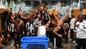 Players Celebrate promotion in the dressing room 