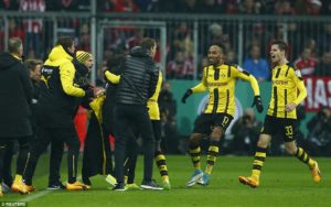 The Dortmund players ran towards the bench to celebrate Dembele's goal