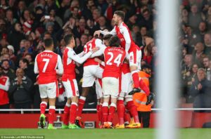 Arsenal Players celebrate after Nacho Monreal's deflected shot ended up in the back of the net 