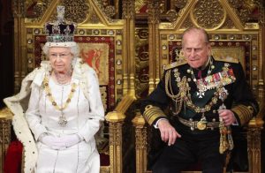 Britain's Queen Elizabeth waits to read the Queen's Speech to lawmakers in the House of Lords, next to Prince Philip, during the State Opening of Parliament in central London May 9, 2012.